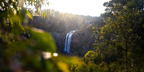 beautiful sunset above famous ebor falls in new south wales, guy fawkes river national park near dorrigo; unique and spectacular double waterfall in australia, halfway between brisbane and sydney
