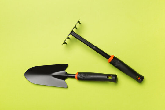 Gardening tools on color background, top view