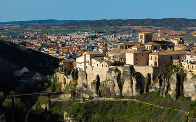 Picturesque view of historic district of Cuenca city on steep spur above deep gorge of Huecar river...