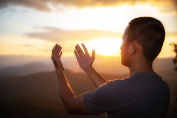 The human hand raises his palm open to worship. Eucharist, bless the Lord, help Catholics repent of Easter. behind the concept of Christianity Battle and Victory for God