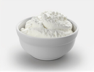Fototapeta na wymiar bowl of whipped cream sits on a white surface.