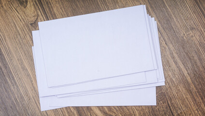 Stack of White Envelopes on a Wooden Background isolated