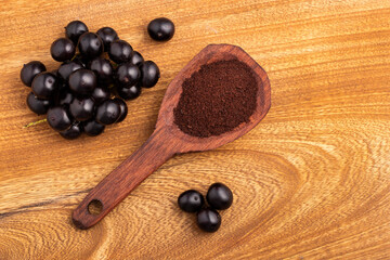 Acai berry powder in spoon - Euterpe oleracea