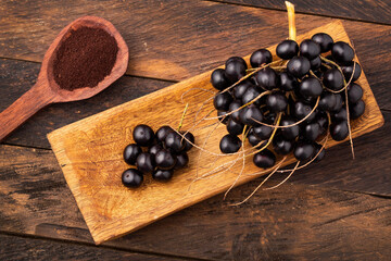 Acai berry powder in spoon - Euterpe oleracea