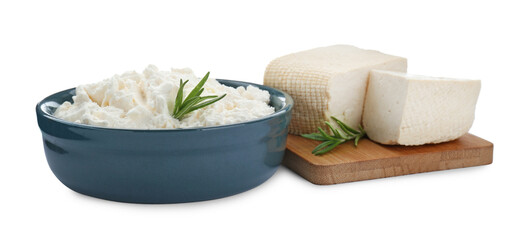 Different types of delicious tofu cheese with rosemary on white background