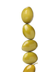 Stack of whole olives on white background