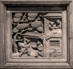 Close-up of exquisite wood carving patterns on doors and Windows of ancient Chinese buildings
