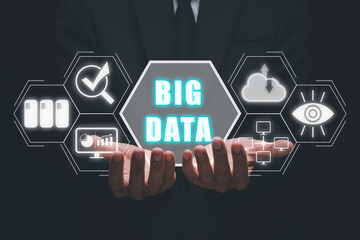 Big data concept, Business person hand holding big data icon on virtual screen.