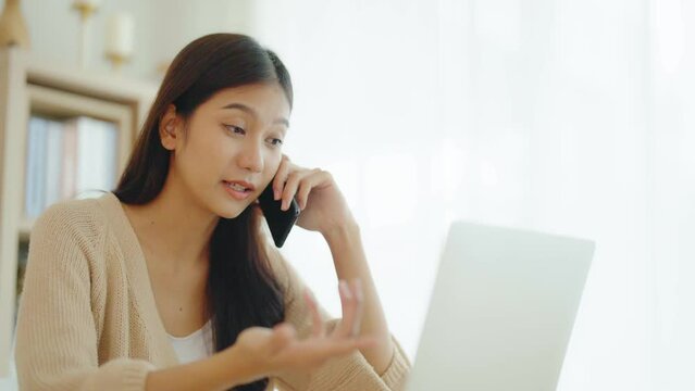 Angry asian woman talk on smartphone arguing or solving problem, irritated young female have cell phone conversation manage work trouble, annoyed lady use mobile call customer service disputing