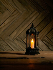Ramadhan lantern or lamp, isolated in wooden background