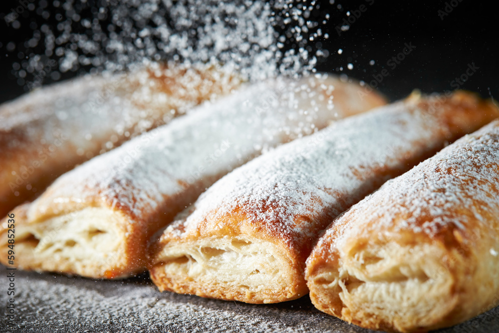 Poster sprinkle powdered sugar on pastry cookies