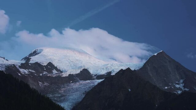 Chamonix Alps snowy mountain and clouds at sunset timelapse