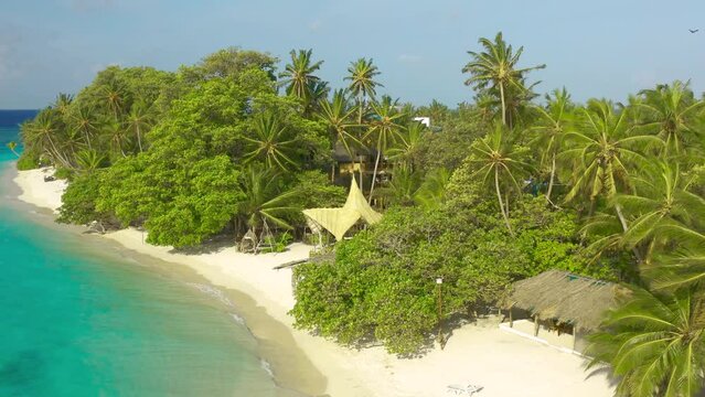 Aerial view on Eco resort on a Caribbean beach with thatched huts and lush tropical vegetation, Bocas del Toro, Panama.