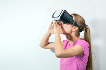 Girl in virtual reality glasses watching surprised shocking video. Young woman looking at futuristic social network map concept