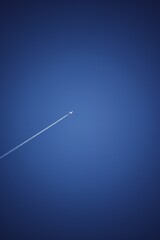 International flight passing through a beautiful blue sky