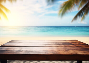 A close-up of an empty wooden table over blurred sunny tropical empty beach background
