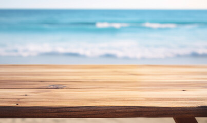 A close-up of an empty wooden table over blurred sunny tropical empty beach background