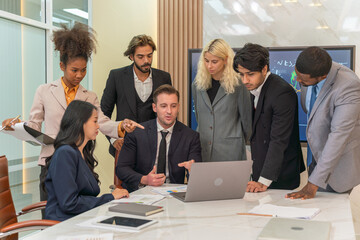 Group of businessmen and businesswomen getting together to discuss work with their boss in a office meeting room. Team of sales person get together to discuss agreement. Boss talking to employees. 