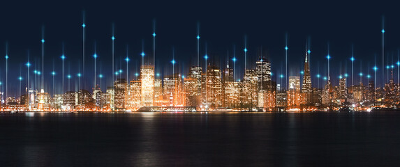 Fototapeta na wymiar City, night and skyline by water with tech, network or light overlay for connection, iot or mockup space. Dark metro, cbd and skyscraper by ocean for development, infrastructure or futuristic mock up