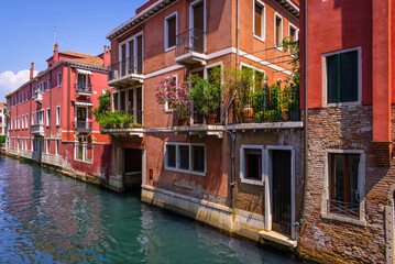 Fototapeta na wymiar Old facades of buildings in Venice viewed from a bridge