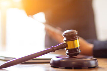 wooden judge gavel on table as symbol of justice for use in legal cases judicial system and civil...