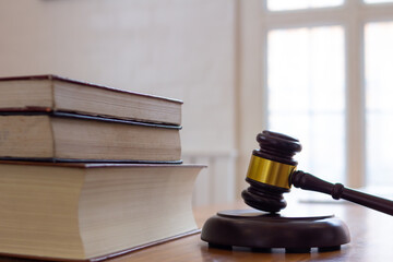 wooden judge gavel on table as symbol of justice for use in legal cases judicial system and civil...