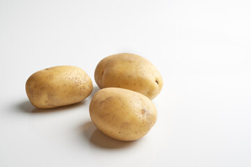 Raw potatos isoalted on white background