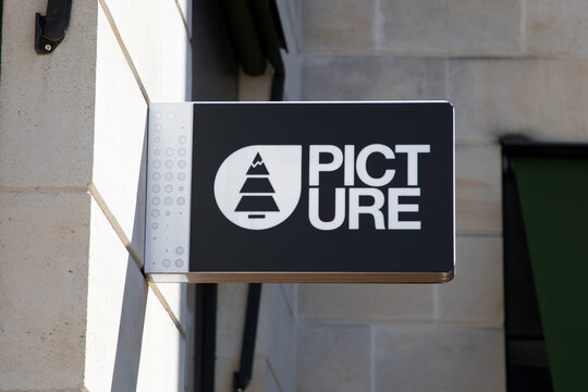 picture store brand logo and text sign shop wall entrance facade boutique