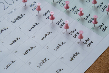 4 day work week printed calendar with pink pins on three days off in week weekend days four day working week concept. Modern approach doing business short workweek. Effectiveness of employees - obrazy, fototapety, plakaty