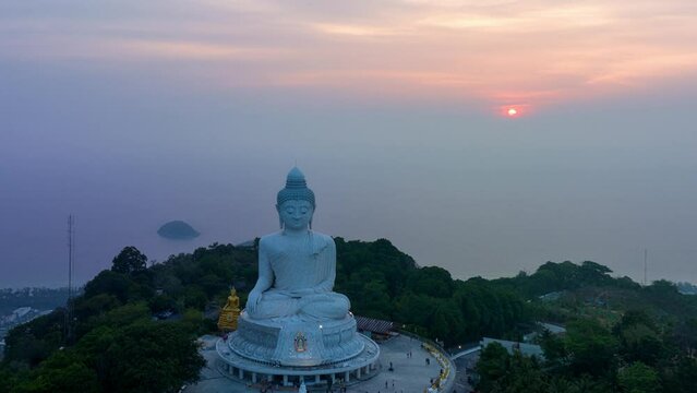 aerial Hyperlapse day to night amazing sky view at Phuket big Buddha ..important and revered landmarks on hill top of Phuket island..colorful sky day to night beautiful nature background