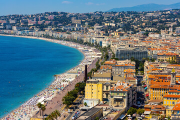 Naklejka premium Nice panorama with Vieille Ville old town district, Promenade des Anglais boulevard and beach at French Riviera of Mediterranean Sea in France