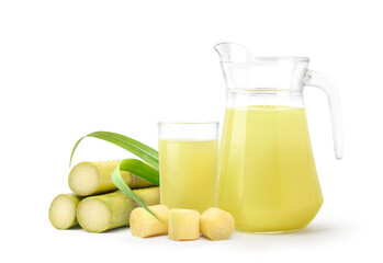 Fresh squeezed sugar cane juice with fresh cane sliced isolated on white background.