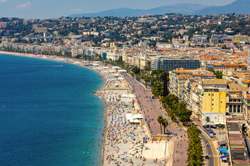 Nice panorama with Vieille Ville old town district, Promenade des Anglais boulevard and beach at French Riviera of Mediterranean Sea in France