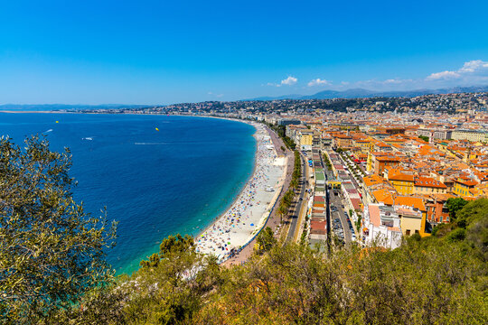 Nice panorama with Vieille Ville old town district, Promenade des Anglais boulevard and beach at French Riviera of Mediterranean Sea in France