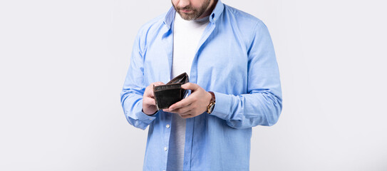 cropped photo of poor man with wallet. poor man with wallet isolated on studio background.