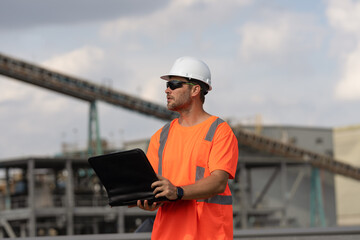 supervisor man with construction project. supervisor man discussing construction project outdoor.