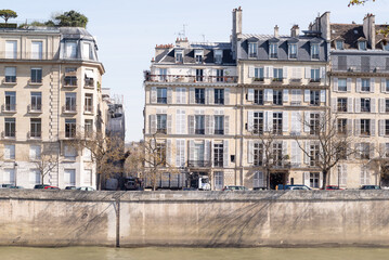 View of parisian buildings facade located around seine river.