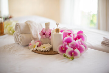The lotion bottle adds a touch of luxury and indulgence to the spa composition making it a treat...