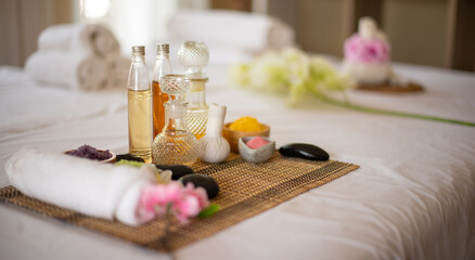 The overall effect of the white linens and spa oil is a soothing and calming environment perfect for relaxation.