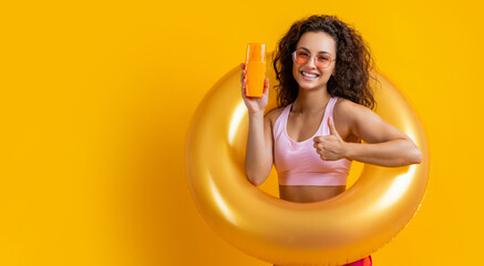 girl skincare with sunscreen in summer isolated on yellow, copy space. girl skincare with sunscreen