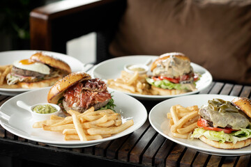 Fototapeta premium selection of many different burgers on restaurant table