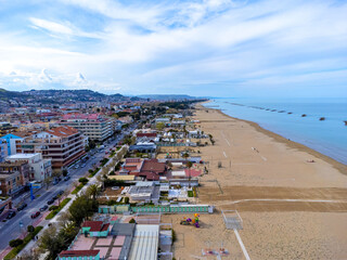 Aerial view landscape Italy Pescara, coast , beach, sea, promenade, buildings and apartments.