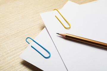 Concept of different office accessories - paper with clip