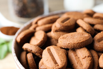 Concept of tasty snack for hot drink - cookies in the shape of coffee seeds