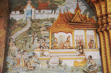 Beautiful Stucco on the Sim or Church architecture of Lan Xang style, there is a mural at Wat Mahathat or Wat That Noi "The Monastery of Stupa" and one of Luang Prabang's most beautiful temples.
