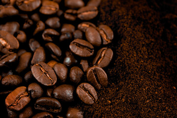 Coffee background. Coffee beans and ground coffee, close up.