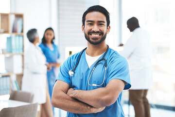 Medical, arms crossed doctor with portrait of man for healthcare, surgery and happy. Smile, medicine and confident with male nurse standing in hospital for wellness, cardiology and expert - obrazy, fototapety, plakaty
