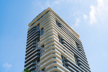 high skyscraper architectural building exterior on blue sky. skyscraper architectural building