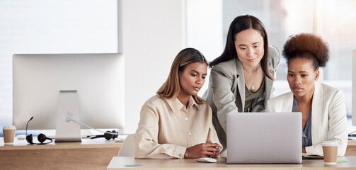 Business women, laptop and team with training, diversity and website development at digital...