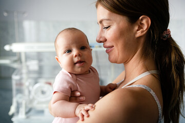 Baby and mother in hospital. New life concept.